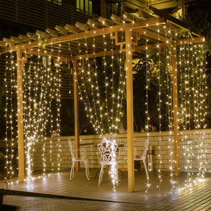 String lights draped over a wooden pergola on a patio
